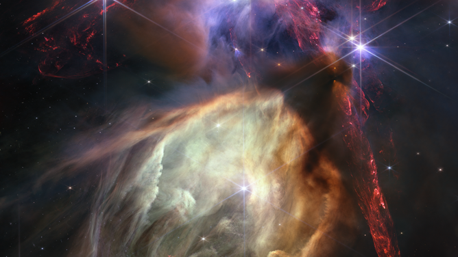 The first anniversary image from NASA’s James Webb Space Telescope displays star birth like it’s never been seen before, full of detailed, impressionistic texture. The subject is the Rho Ophiuchi cloud complex, the closest star-forming region to Earth. It is a relatively small, quiet stellar nursery, but you’d never know it from Webb’s chaotic close-up.
