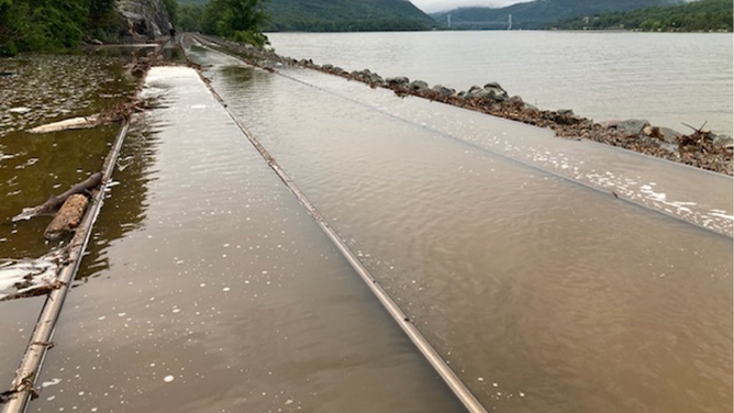 Floodwaters cover railroad tracks in New York state on Sunday, July 9, 2023.