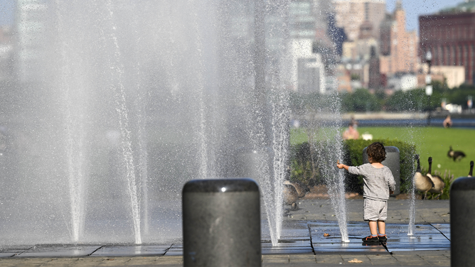 NEW YORK, US - JULY 24: People are struggling with hot weather in New York on July 24, 2023.