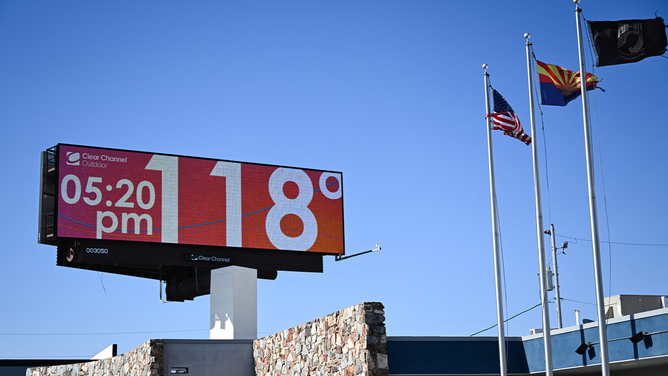 A billboard displays a temperature of 118 degrees Fahrenheit (48 degrees Celcius) during a record heat wave in Phoenix, Arizona on July 18, 2023. Swaths of the United States home to more than 80 million people were under heat warnings or advisories, as relentless, record-breaking temperatures continued to bake western and southern states. In Arizona, state capital Phoenix recorded its 17th straight day above 109 degrees Fahrenheit (43 degrees Celsius), as temperatures hit 113F (45C) Sunday afternoon.