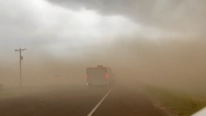 A still image taken from video shot near Amarillo, Texas on Sunday shows dust covering the highway.