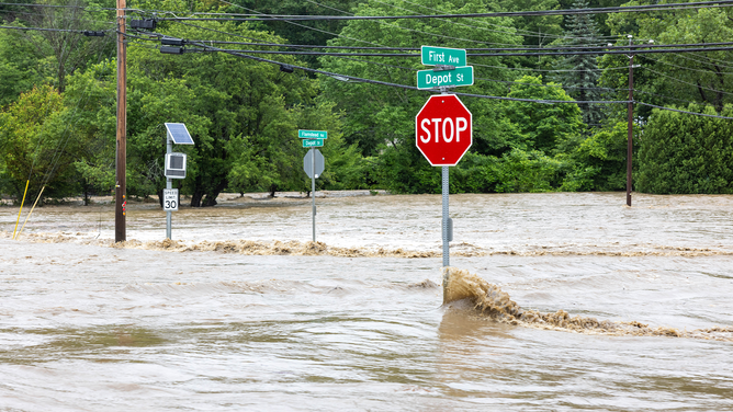 CHESTER, VERMONT - JULY 10: A flooded road is seen on July 10, 2023 in Chester, Vermont. Torrential rain and flooding has affected millions of people from Vermont south to North Carolina.