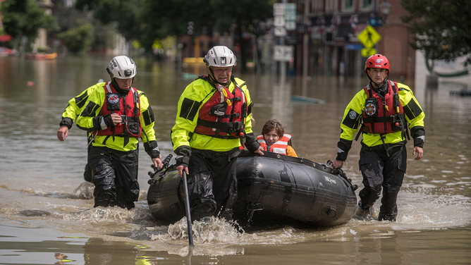 MONTPELIER, VT - JULY, 11: Members of the Colchester Technical Rescue team respond to a call to evacuate two adults and an infant from their downtown Montpelier, Vermont apartment on Tuesday afternoon, July 11, 2023. Vermont has been under a State of Emergency since Sunday evening as heavy rains continued through Tuesday morning causing flooding across the state.