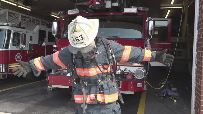 Meteorologist Nick Kosir is seen wearing firefighting equipment during his ride-along with the Long Branch, New Jersey, Fire Department.