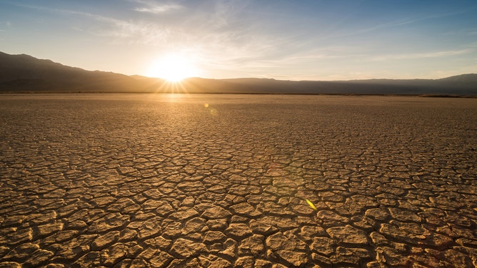 Cracked mud stretches across sections of Panamint Valley in Death Valley National Park.
