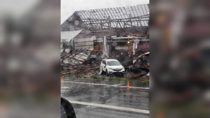 Severe storms damage building in Lewisburg, Pennsylvania, on Sunday.