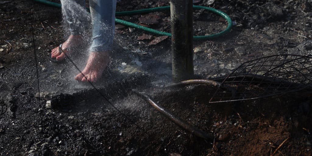 Ash pits hide dangerous burning embers even after wildfires are