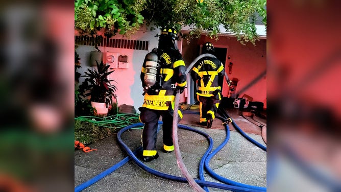 Firefighters respond to fire cause by lightning strike.