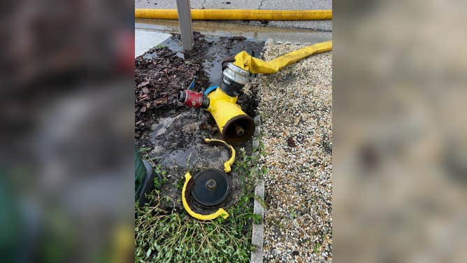 The broken hydrant.