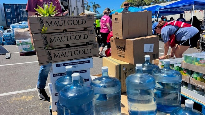 Delivering pineapples, water and supplies.