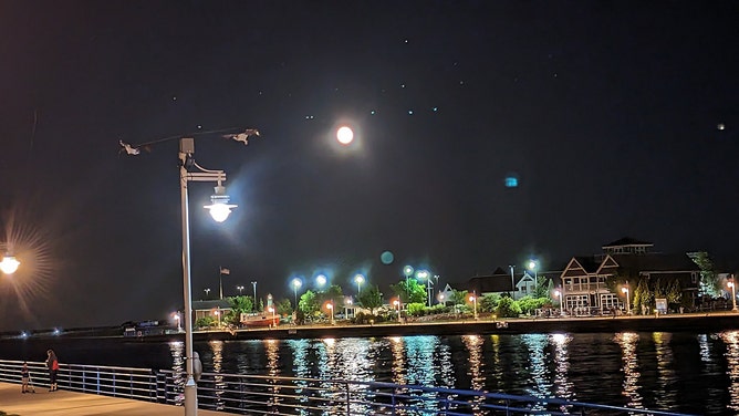 Alex Donovan shot this photo of August’s second full moon rising over the Sheboygan River in Sheboygan, Wisconsin, on Wednesday, August 30, 2023.