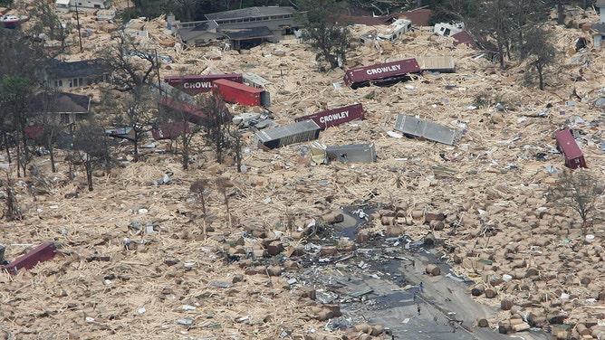 A residential area is engulfed in shipping containers, RVs, and boats washed ashore on August 30, 2005, in Gulfport, Mississippi following high winds and waves of Hurricane Katrina.