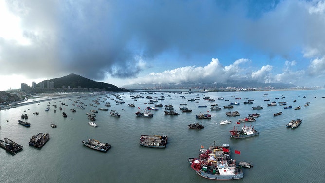 Fishing boats berth to take shelter from Super Typhoon Khanun at Liandao Central fishing port in Lianyungang, Jiangsu province, Aug 1, 2023.