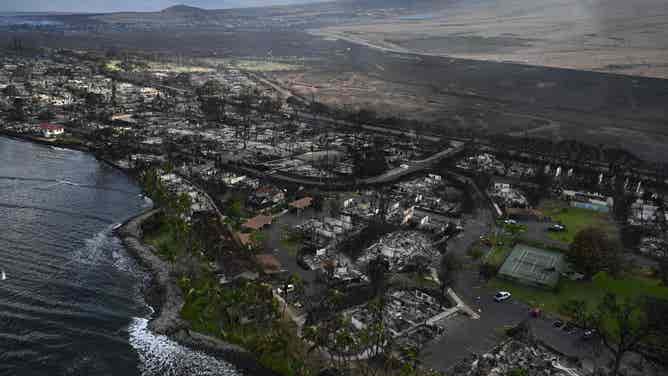 TOPSHOT - An aerial view shows destruction caused by a wildfire in Lahaina, on the Hawaiian island of Maui, on August 10, 2023. At least 36 people have died after a fast-moving wildfire turned Lahaina to ashes, officials said August 9, as visitors asked to leave the island of Maui found themselves stranded at the airport. The fires began burning early August 8, scorching thousands of acres and putting homes, businesses and 35,000 lives at risk on Maui, the Hawaii Emergency Management Agency said in a statement. (Photo by Patrick T. Fallon / AFP) (Photo by PATRICK T. FALLON/AFP via Getty Images)