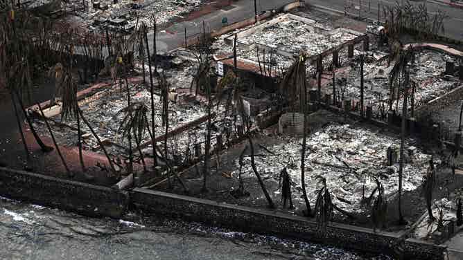 An aerial image taken on August 10, 2023 shows destroyed homes and buildings burned to the ground in Lahaina in the aftermath of wildfires in western Maui, Hawaii. At least 36 people have died after a fast-moving wildfire turned Lahaina to ashes, officials said August 9, 2023 as visitors asked to leave the island of Maui found themselves stranded at the airport. The fires began burning early August 8, scorching thousands of acres and putting homes, businesses and 35,000 lives at risk on Maui, the Hawaii Emergency Management Agency said in a statement. (Photo by Patrick T. Fallon / AFP) (Photo by PATRICK T. FALLON/AFP via Getty Images)