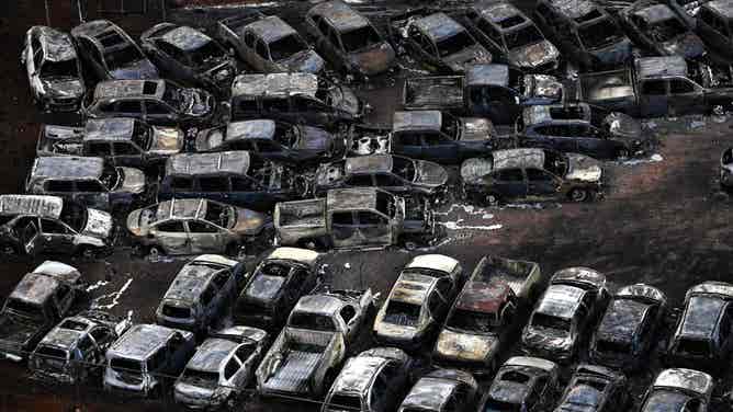 An aerial image taken on August 10, 2023 shows destroyed cars in Lahaina in the aftermath of wildfires in western Maui, Hawaii. At least 36 people have died after a fast-moving wildfire turned Lahaina to ashes, officials said August 9, 2023 as visitors asked to leave the island of Maui found themselves stranded at the airport. The fires began burning early August 8, scorching thousands of acres and putting homes, businesses and 35,000 lives at risk on Maui, the Hawaii Emergency Management Agency said in a statement. (Photo by Patrick T. Fallon / AFP) (Photo by PATRICK T. FALLON/AFP via Getty Images)