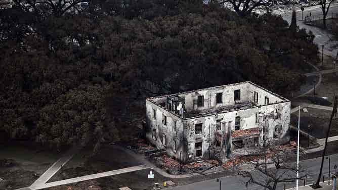 An aerial image shows a burned building in the historic Lahaina in the aftermath of wildfires in western Maui in Lahaina, Hawaii, on August 10, 2023. At least 36 people have died after a fast-moving wildfire turned Lahaina to ashes, officials said August 9, as visitors asked to leave the island of Maui found themselves stranded at the airport. The fires began burning early August 8, scorching thousands of acres and putting homes, businesses and 35,000 lives at risk on Maui, the Hawaii Emergency Management Agency said in a statement. (Photo by Patrick T. Fallon / AFP) (Photo by PATRICK T. FALLON/AFP via Getty Images)