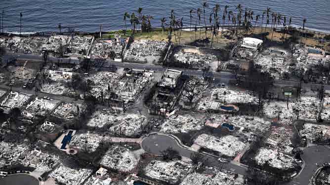 An aerial image taken on August 10, 2023 shows destroyed homes and buildings burned to the ground in Lahaina in the aftermath of wildfires in western Maui, Hawaii. At least 36 people have died after a fast-moving wildfire turned Lahaina to ashes, officials said August 9, 2023 as visitors asked to leave the island of Maui found themselves stranded at the airport. The fires began burning early August 8, scorching thousands of acres and putting homes, businesses and 35,000 lives at risk on Maui, the Hawaii Emergency Management Agency said in a statement. (Photo by Patrick T. Fallon / AFP) (Photo by PATRICK T. FALLON/AFP via Getty Images)