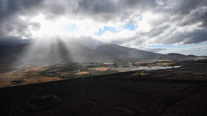 An aerial image shows a burned hillside above Lahaina in the aftermath of wildfires in western Maui in Lahaina, Hawaii, on August 10, 2023. At least 36 people have died after a fast-moving wildfire turned Lahaina to ashes, officials said August 9, 2023 as visitors asked to leave the island of Maui found themselves stranded at the airport. The fires began burning early August 8, scorching thousands of acres and putting homes, businesses and 35,000 lives at risk on Maui, the Hawaii Emergency Management Agency said in a statement. (Photo by Patrick T. Fallon / AFP) (Photo by PATRICK T. FALLON/AFP via Getty Images)