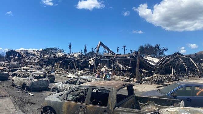 Burned cars, destroyed buildings and homes are pictured in the aftermath of a wildfire in Lahaina, western Maui, Hawaii on August 11, 2023.