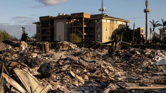 Charred remains of an apartment complex in the aftermath of a wildfire in Lahaina, western Maui, Hawaii on August 12, 2023. Hawaii's Attorney General, Anne Lopez, said August 11, she was opening a probe into the handling of devastating wildfires that killed at least 80 people in the state this week, as criticism grows of the official response. The announcement and increased death toll came as residents of Lahaina were allowed back into the town for the first time.