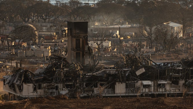 TOPSHOT - Burned houses and buildings are pictured in the aftermath of a wildfire, is seen in Lahaina, western Maui, Hawaii on August 12, 2023. Hawaii's Attorney General, Anne Lopez, said August 11, she was opening a probe into the handling of devastating wildfires that killed at least 80 people in the state this week, as criticism grows of the official response. The announcement and increased death toll came as residents of Lahaina were allowed back into the town for the first time.