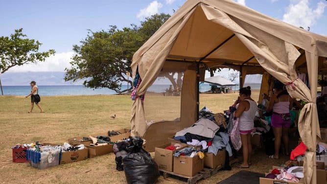 Donated clothes are seen at a distribution center for those affected by the Maui fires at Honokawai Beach Park in Napili-Honokowai, west of Maui, Hawaii, August 14, 2023.