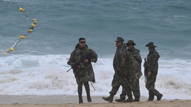 Members of the Mexican Navy patrol the Medano beach before the arrival of hurricane Hilary at Los Cabos resort in Baja California state, Mexico on August 18, 2023. Hurricane Hilary strengthened into a major storm in the Pacific on Friday and was expected to further intensify before approaching Mexico's Baja California peninsula over the weekend, forecasters said.