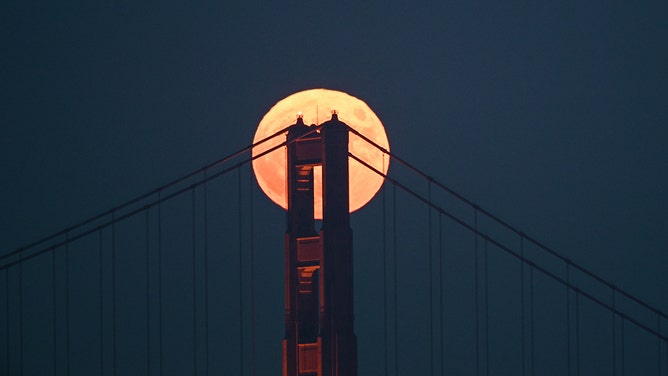 Super moon known as 'blue moon' rises over the Golden Gate Bridge in San Francisco, California, on August 30, 2023.