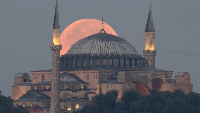 Super blue moon moving lower in the sky over Hagia Sophia Grand Mosque in Istanbul, Turkiye on August 31, 2023.