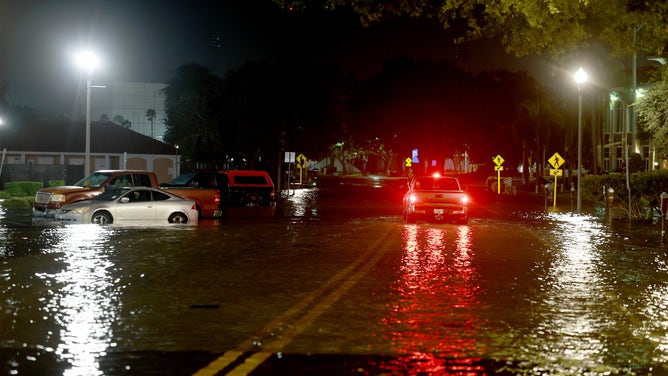 ST PETERSBURG, FLORIDA - AUGUST 30: A vehicle drives through flood waters caused by Hurricane Idalia passing offshore on August 30, 2023 in St. Petersburg, Florida. Hurricane Idalia is hitting the Big Bend area of Florida.