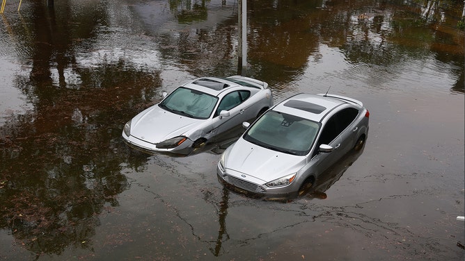 Cars sit in flood waters from Hurricane Idalia after it passed offshore on August 30, 2023 in Tarpon Springs, Florida. Hurricane Idalia is hitting the Big Bend area of Florida.