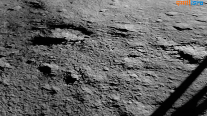 An image showing the lunar South Pole taken by India's Chandrayaan-3 mission on August 23, 2023. The shadow of the lander's leg can be seen in the lower right.