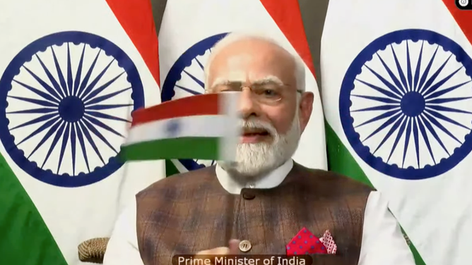 India Prime Minister Narendra Modi waves India's flag after the Chandrayaan-3 landing on the lunar South Pole on August, 23, 2023.