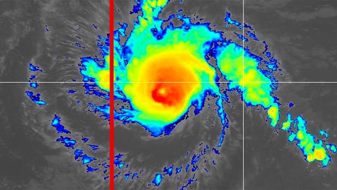 Hurricane Dora is seen on a satellite image taken Aug. 11, 2023. The International Date Line is highlighted in red.