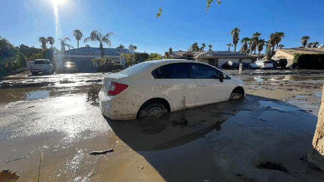 Cathedral City residents are still stuck in their homes because mud over a foot thick covers some streets.