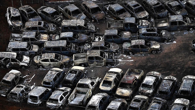 An aerial image taken on August 10, 2023 shows destroyed cars in Lahaina in the aftermath of wildfires in western Maui, Hawaii.