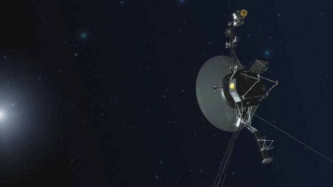 Artist concept showing NASA’s Voyager spacecraft against a backdrop of stars.