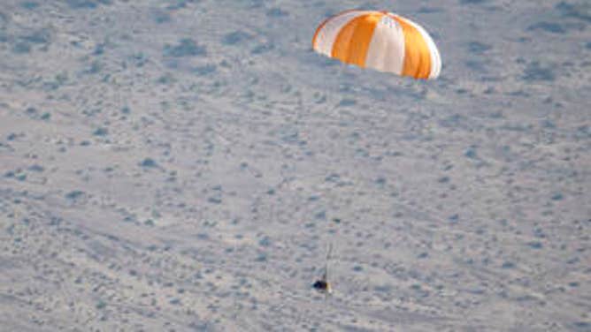 A training model of the sample return capsule is seen is seen during a drop test in preparation for the retrieval of the sample return capsule from NASA's OSIRIS-REx mission, Wednesday, Aug. 30, 2023, at the Department of Defense's Utah Test and Training Range.