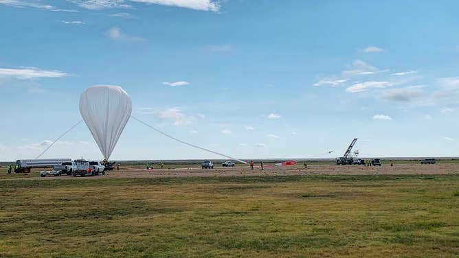 A scientific balloon for the fall campaign is inflated before it will be released for flight in Fort Sumner, New Mexico.