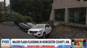 Sinkhole swallows 3 Cadillacs at Massachusetts dealership during flash flooding