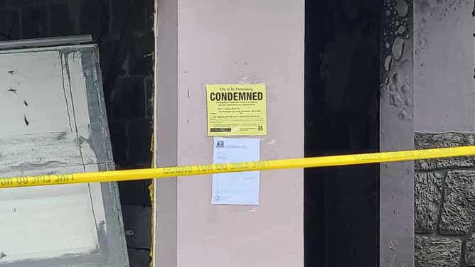 A "Condemned" sign posted on the home.