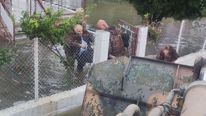 The Greek Army used a bulldozer to evacuate residents from heavily flooded areas in central Greece on Thursday, September 7, after torrential rain swamped the region.