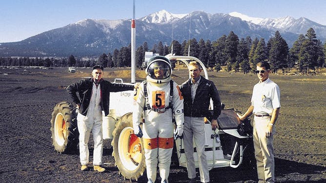 Photo caption: USGS Field Test Support Unit (left to right) Dick Wiser, John Hendricks, Bill Tinnin and Putty Mills with the Explorer, a lunar rover vehicle simulator at Cinder Lake Crater Field east of Flagstaff, December 1968.