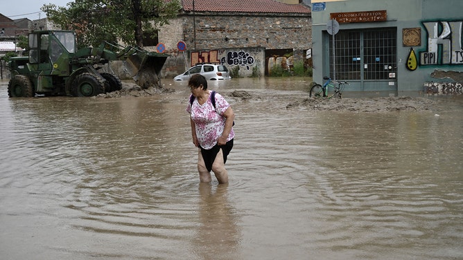 A local resident walks in a flooded street in Volos, central Greece, on September 6, 2023. The regional capital Volos has seen about 8 inches of rain, according to the National Meteorological Service (EMY).