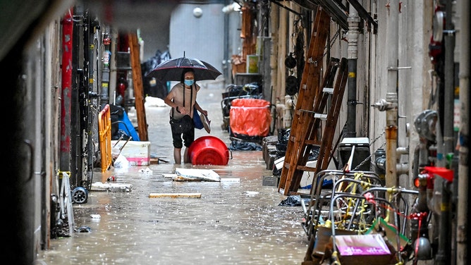Record flooding strikes Hong Kong as deadly deluge injures over 140 ...
