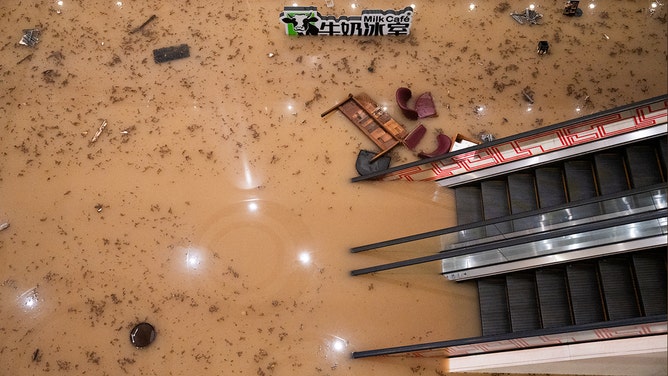 Flood water covers the floor of a shopping mall in Hong Kong on September 8, 2023.