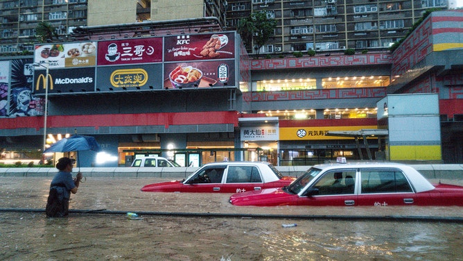 Vehicles submerged in floodwater during heavy rain in Hong Kong, China, on Friday, Sept. 8, 2023.