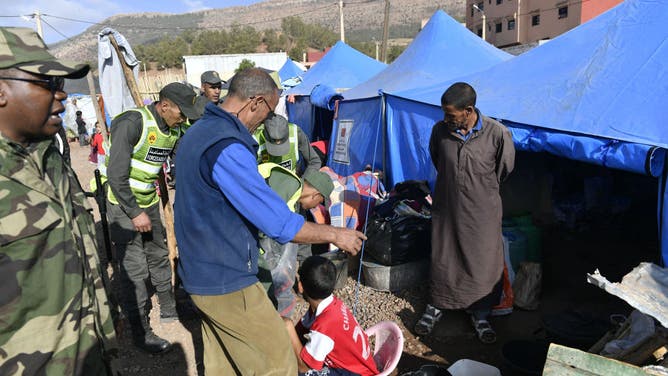 Moroccan Civil Defense Institution distribute relief materials to earthquake survivors at the tent city after 7 magnitude earthquake in Al-Haouz region, Marrakesh, Morocco on September 12, 2023.