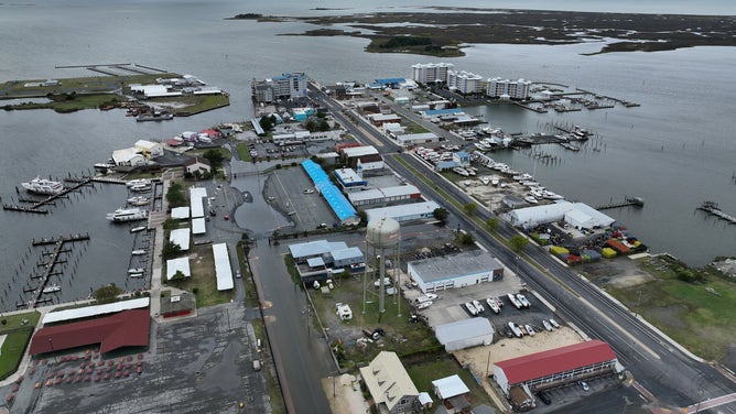 CRISFIELD, MD - SEPTEMBER 24: In this aerial view, the Chesapeake Bay stretches out past the downtown area following two days of heavy rain from Tropical Storm Ophelia on September 24, 2023 in Crisfield, Maryland. Ophelia made landfall early Saturday in North Carolina, producing high winds and heavy rain across the Carolinas, Virginia, Maryland, Delaware, and New Jersey. The city of Crisfield will apply for Federal Emergency Management Agency and Maryland Department of Emergency Management grants to help pay for a $63 million flood control program to mitigate flooding by raising roads, building new tide gates, berms, and other projects.